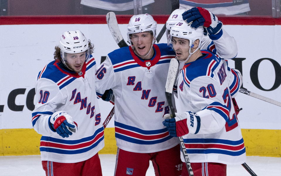 New York Rangers' Ryan Strome, center, celebrates his goal against the Montreal Canadiens with teammates Artemi Panarin, left, and Chris Kreider during the third period of an NHL hockey game Thursday, Feb. 27, 2020, in Montreal. (Paul Chiasson/The Canadian Press via AP)