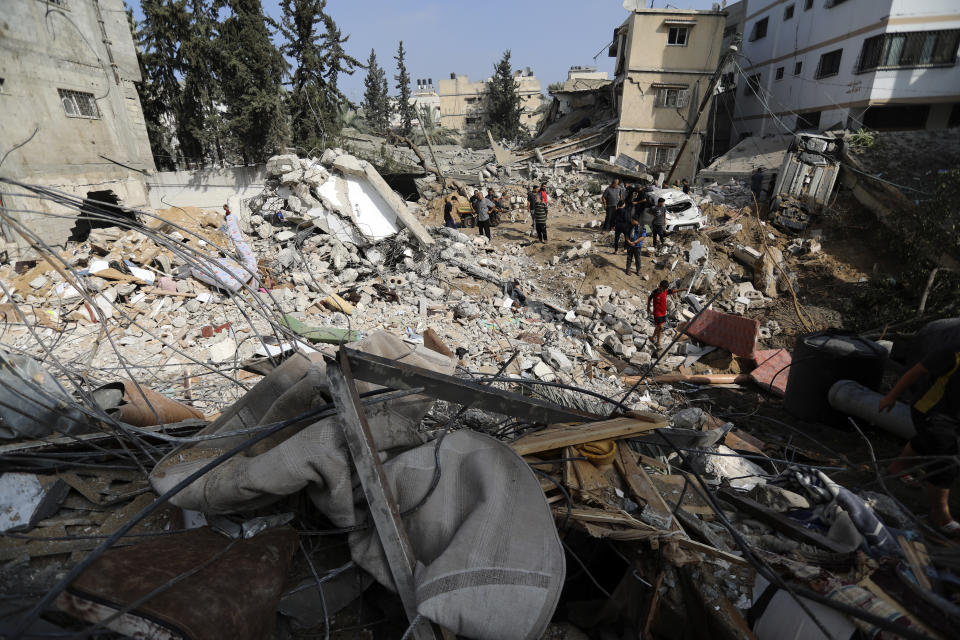 Palestinians inspect the damage of a destroyed house following Israeli airstrikes on Gaza City, Wednesday, Nov. 8, 2023. (AP Photo/Abed Khaled)