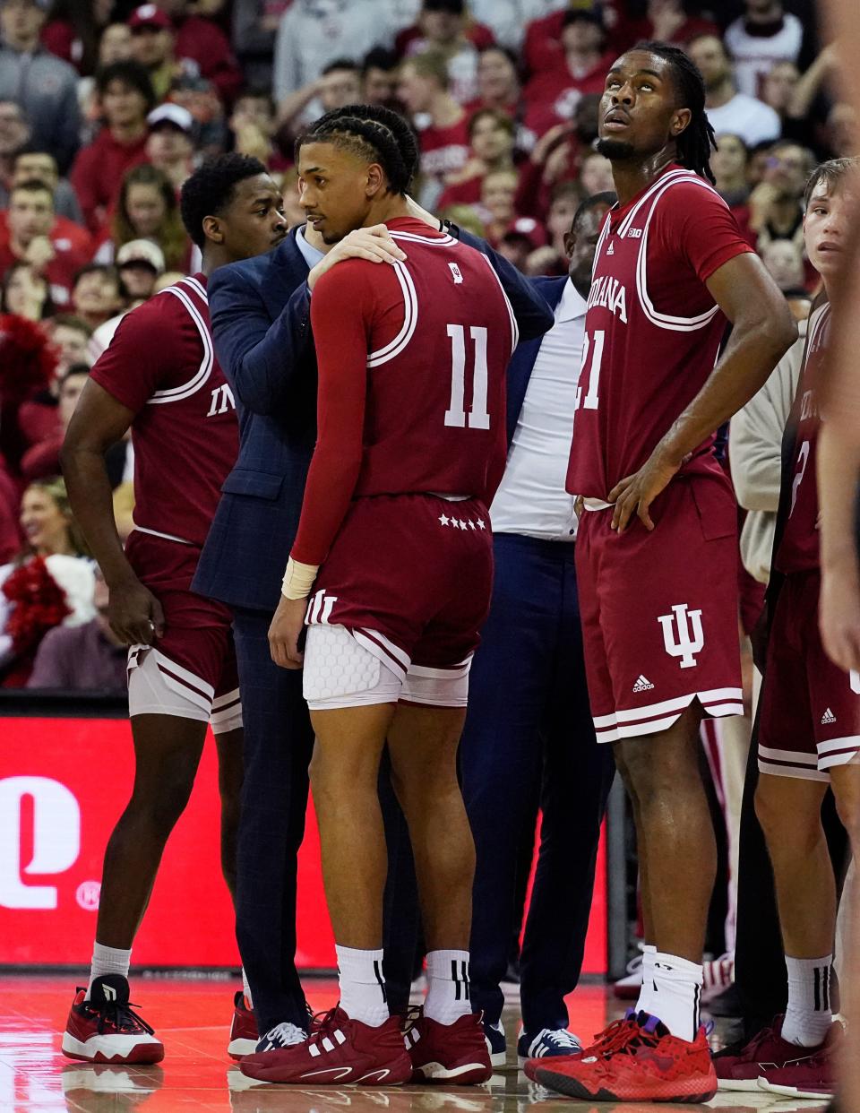 Indiana Hoosiers guard CJ Gunn (11) speaks with a coach as he is ejected for a foul on Wisconsin Badgers guard Max Klesmit (11) during the second half of their game on Friday January 19, 2024 at the Kohl Center in Madison, Wis.