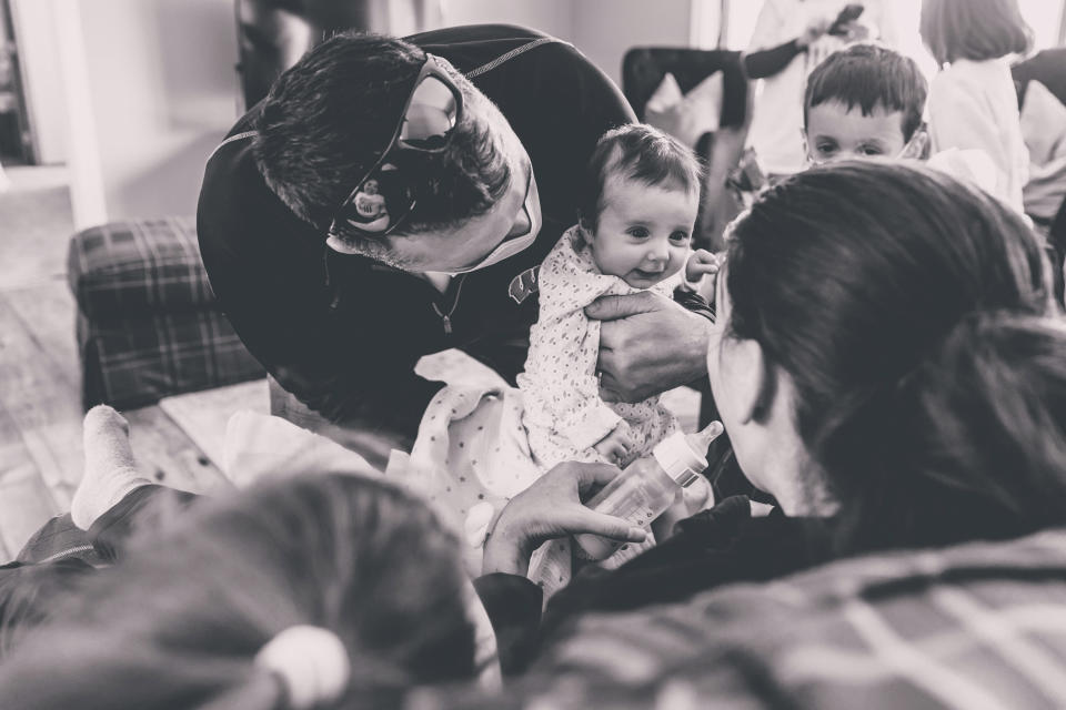 In this Jan. 27, 2021 photo provided by Taryn Marie Photography, Derek Townsend brings his daughter Lucy to meet her mother Kelsey Townsend for the first time, face to face in Poynette, Wis. Kelsey Townsend gave birth to Lucy via C-section on Nov. 4 while in a medically induced coma due to COVID-19. She spent 75 days on lung and life support. She finally met the daughter she delivered face to face on Jan. 27. (Taryn Ziegler/Taryn Marie Photography via AP)