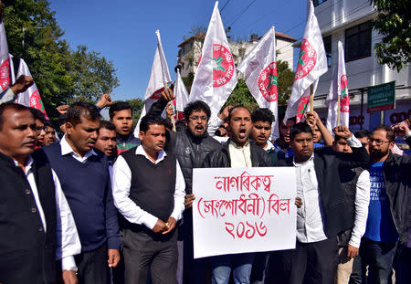 Activists from the All Assam Students Union (AASU) shout slogans during a protest against the government's bid to pass a bill in parliament to give citizenship to non-Muslims from neighbouring countries, in Guwahati, India January 7, 2019. The placard reads "Citizenship Amendment Bill 2016". REUTERS/Anuwar Hazarika