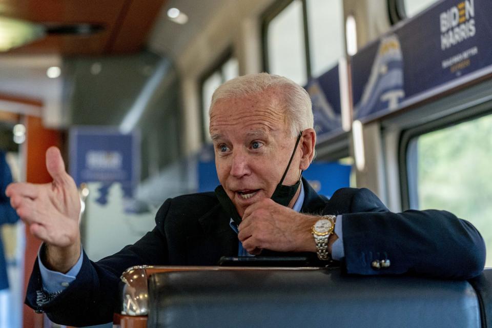 Democratic presidential candidate former Vice President Joe Biden speaks with United Steelworkers Union President Thomas Conway and school teacher Denny Flora of New Castle, Pa., aboard his train as it travels to Pittsburgh, Wednesday, Sept. 30, 2020. Biden is on a train tour through Ohio and Pennsylvania today. (AP Photo/Andrew Harnik)