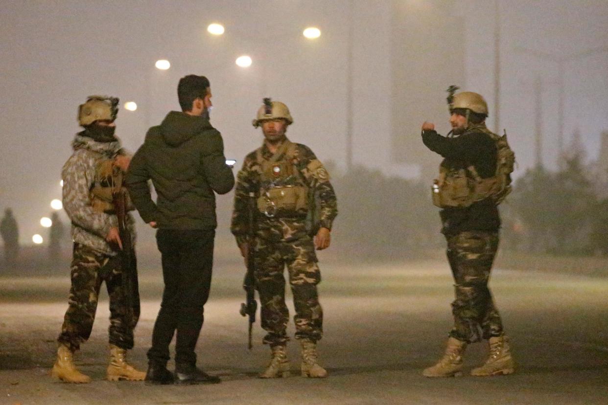 Afghan security forces keep watch near the site of an attack on the Intercontinental Hotel in Kabul: REUTERS