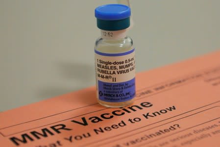 FILE PHOTO: A vial of measles, mumps and rubella vaccine and an information sheet is seen at Boston Children's Hospital in Boston