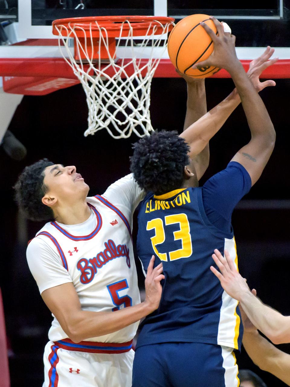 Bradley's Christian Davis (5) tries to stop Murray State's Nick Ellington at the basket in the second half of their Missouri Valley Conference basketball game Wednesday, Jan. 24, 2024 at Carver Arena in Peoria. The Braves defeated the Racers 71-63.