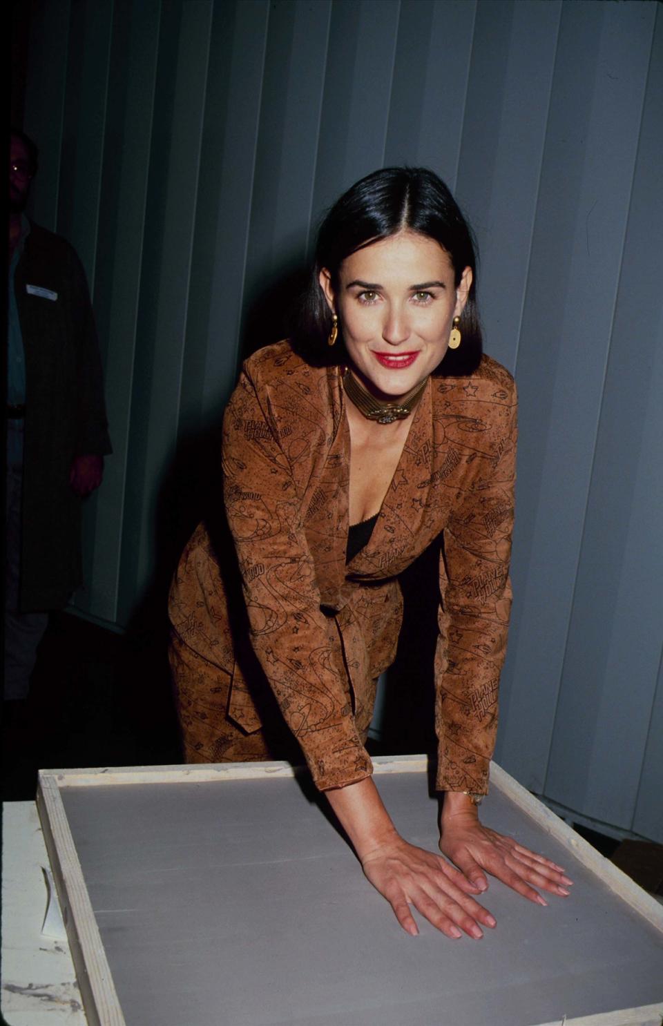 In honor of her 56th birthday, here is a look back at Demi Moore's best beauty moments, from her bowl cut to her shaved head.