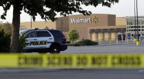 <p>San Antonio police officers investigate the scene where eight people were found dead in a tractor-trailer loaded with at least 30 others outside a Walmart store in stifling summer heat in what police are calling a horrific human trafficking case, Sunday, July 23, 2017, in San Antonio. (AP Photo/Eric Gay) </p>