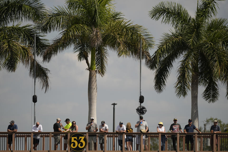 Baseball fans watch during a spring training baseball game as the Baltimore Orioles and the Pittsburgh Pirates play, Tuesday, Feb. 28, 2023, in Bradenton, Fla. (AP Photo/Brynn Anderson)
