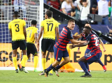 Jul 26, 2017; Santa Clara, CA, USA; United States forward Jordan Morris (center) celebrates with forward Jozy Altidore after scoring a goal in the second half against Jamaica during the CONCACAF Gold Cup final at Levi's Stadium. Mandatory Credit: Mark J. Rebilas-USA TODAY Sports