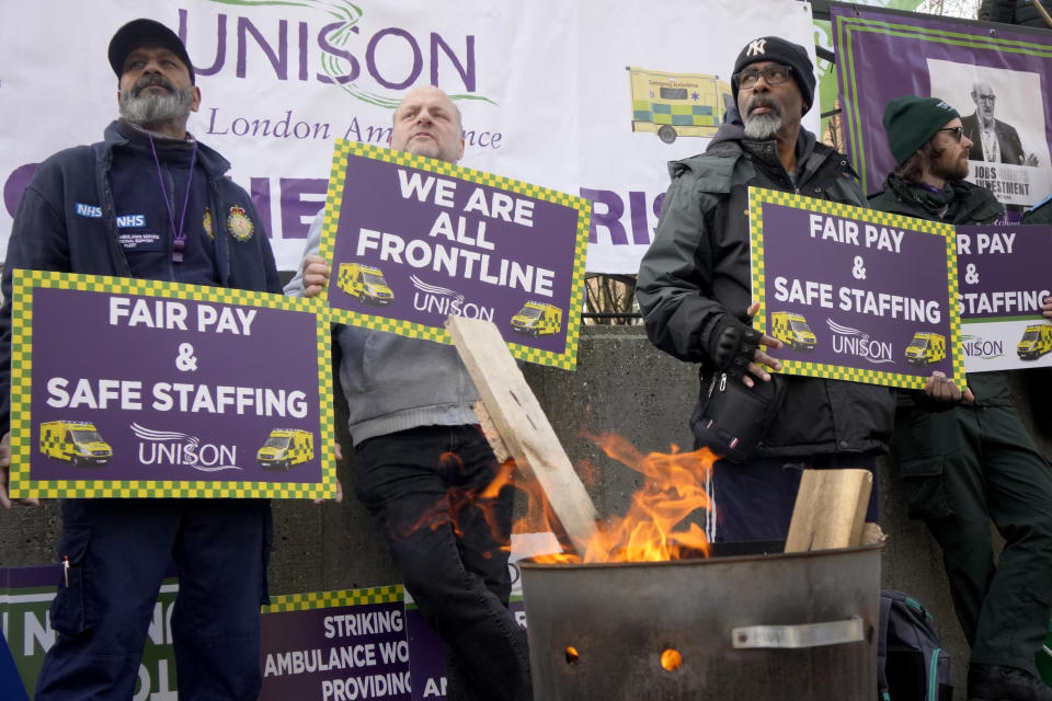 Ambulance workers stand on a picket line during a strike by members of the Unison union in the long-running dispute over pay and staffing, in London, Friday, Feb. 10, 2023.(AP Photo/Kirsty Wigglesworth)