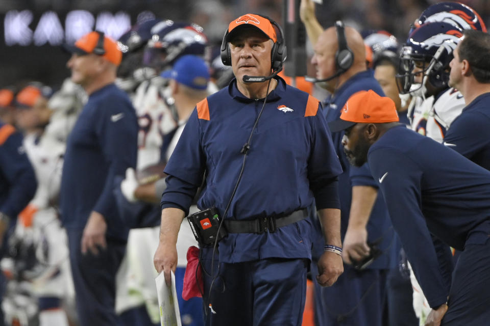 Denver Broncos head coach Vic Fangio walks along the sidelines during the second half of an NFL football game against the Las Vegas Raiders, Sunday, Dec. 26, 2021, in Las Vegas. (AP Photo/David Becker)