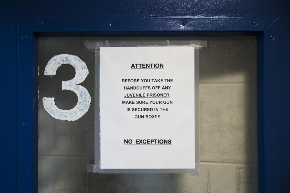 This Friday, Oct. 26, 2018, photo shows a sign on a door at one of Police 9th District's juvenile holding cells in Philadelphia. Bloomberg Philanthropies announced the winners Monday of the U.S. Mayors Challenge that asked cities to develop innovative solutions to their biggest problems that other cities could copy. Philadelphia plans to build a juvenile justice hub designed to make contact with police less traumatic, keep more children out of the criminal justice system and connect at-risk juveniles with intervention services at a crisis point that could change their lives. (AP Photo/Matt Rourke)