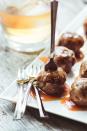 <p>These mini meatballs are slathered in a bourbon sauce for extra punch.</p><p><strong>Get the recipe at <a href="http://theviewfromgreatisland.com/2012/09/its-five-oclock-somewhere-friday-bourbon-meatballs.html" rel="nofollow noopener" target="_blank" data-ylk="slk:The View From Great Island;elm:context_link;itc:0;sec:content-canvas" class="link ">The View From Great Island</a>.</strong></p>