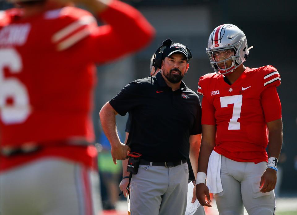 Ohio State Buckeyes head coach Ryan Day and Ohio State Buckeyes quarterback C.J. Stroud (7) talk during a timeout in the third quarter of a NCAA Division I football game between the Ohio State Buckeyes and the Maryland Terrapins on Saturday, Oct. 9, 2021 at Ohio Stadium in Columbus, Ohio.