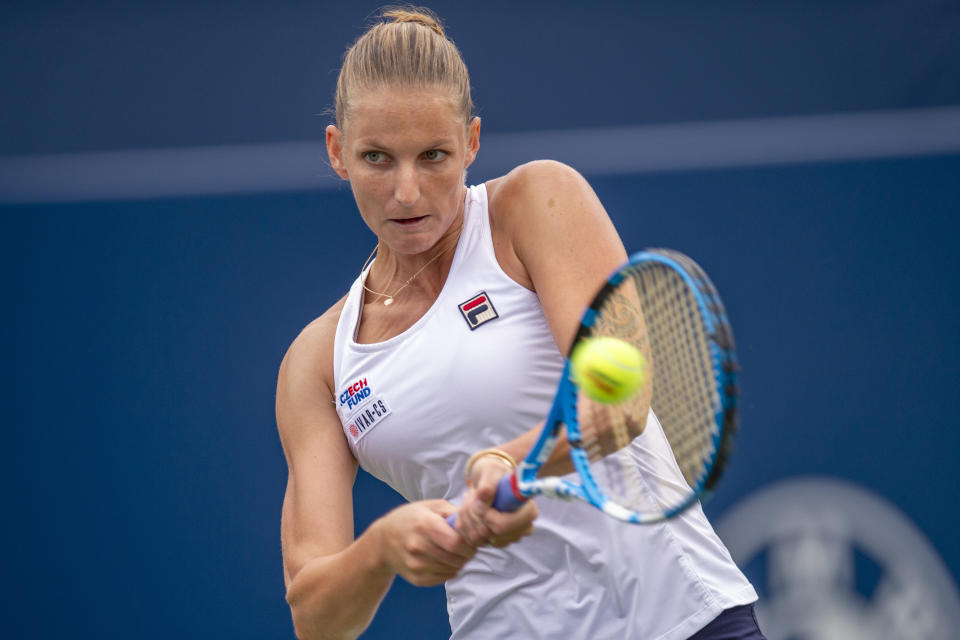 Karolina Pliskova, of the Czech Republic, hits a backhand to Anett Kontaveit, of Estonia, at the Rogers Cup tennis tournament in Toronto, Thursday, Aug. 8, 2019. (Frank Gunn/The Canadian Press via AP)