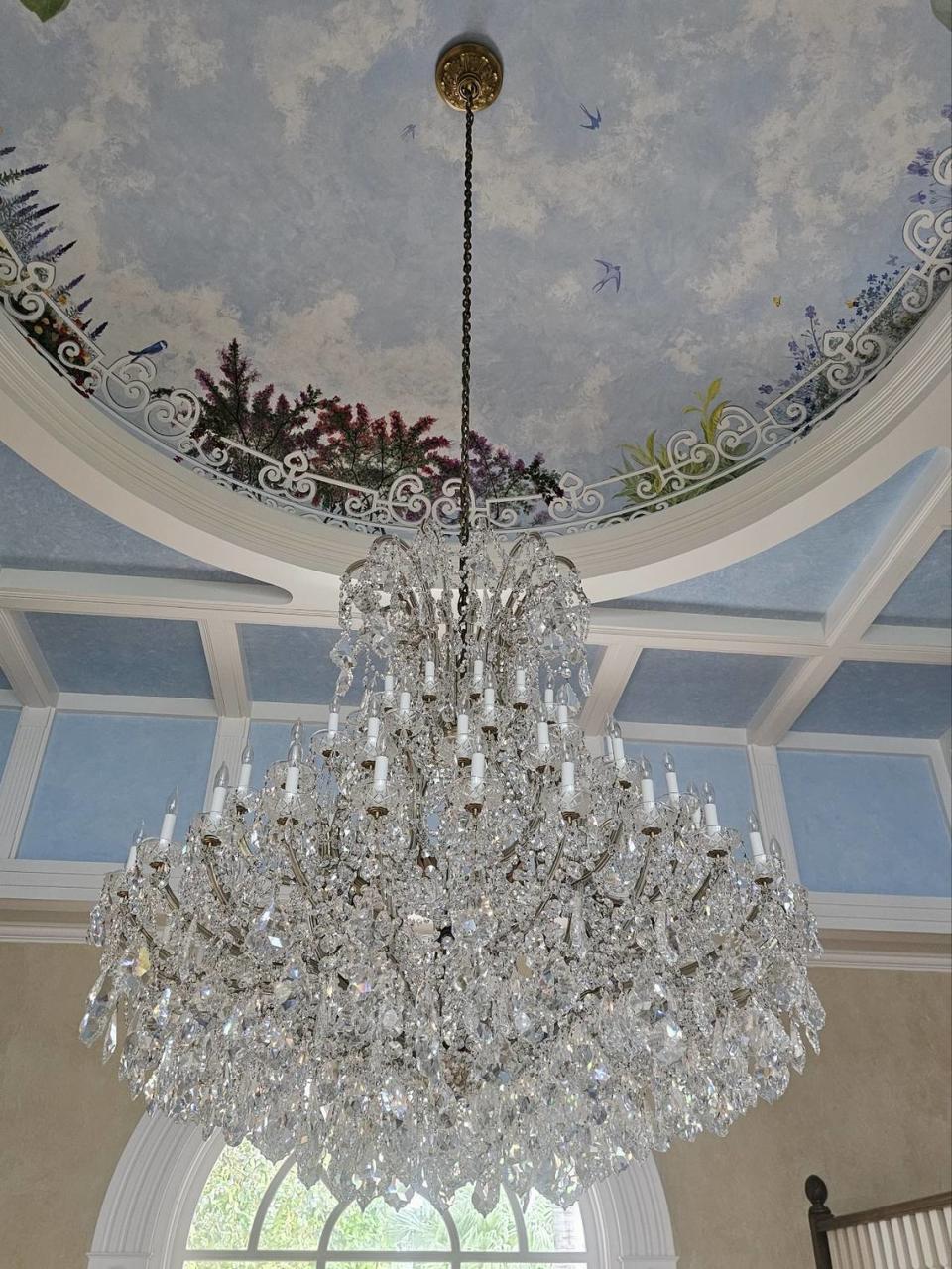 Chandeliers are for sale at the La Maison Blanche auction in Fort Lauderdale.