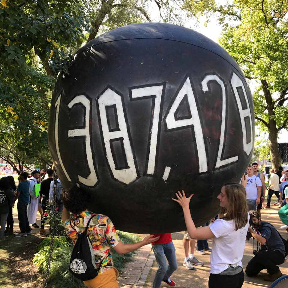 ST LOUIS, MO - OCTOBER 09: Students hold a giant ball representing student debt outside the U.S. presidential debate at Washington University in St. Louis, Missouri,  on Sunday, Oct. 9, 2016. (Photo by Brooks Kraft/ Getty Images)