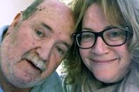 This undated selfie photo provided by Susan Kenney shows Kenney with her late father Charles Lowell, when he resided at the Holyoke Soldiers' Home in Holyoke, Mass. Lowell died April 15, 2020, after contracting the new coronavirus while residing at the veterans' home. He was 78. (Susan Kenney via AP)