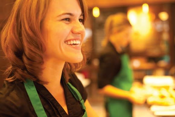 A smiling Starbucks barista.