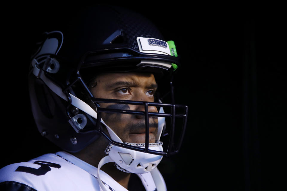 FILE - In this Jan. 5, 2020, file photo, Seattle Seahawks' Russell Wilson waits to run onto the field for the team's NFL wild-card playoff football game against the Philadelphia Eagles in Philadelphia. Speaking to the media for the first time since the end of last season, Wilson didn't care to talk about the game that’s helped make him famous. “To be honest with you, I don’t even want to talk about football right now,” Wilson said during a video conference Wednesday, June 3. 