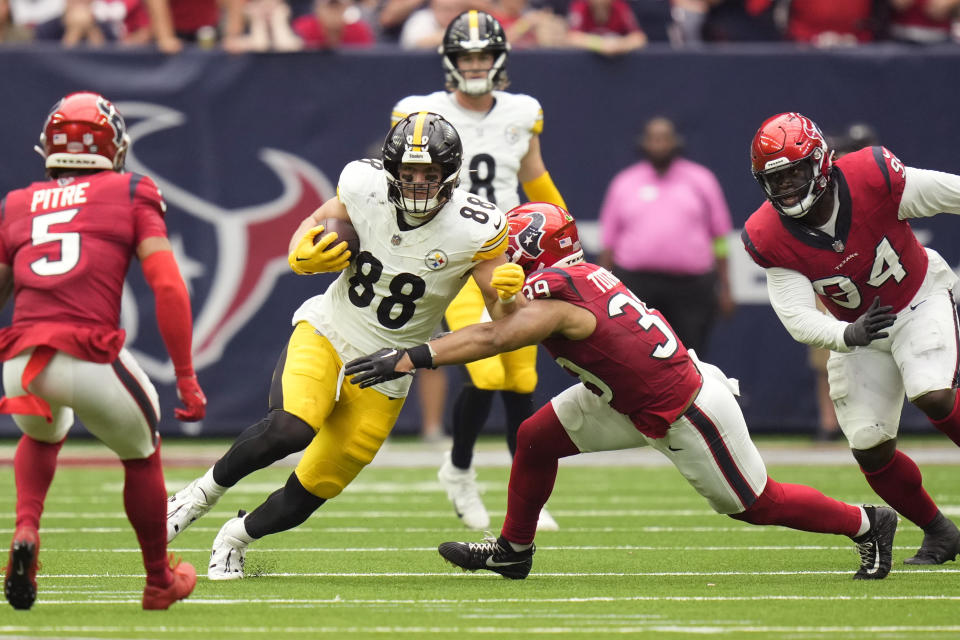 Pittsburgh Steelers tight end Pat Freiermuth (88) is hit by Houston Texans linebacker Henry To'oTo'o (39) after a catch during the first half of an NFL football game Sunday, Oct. 1, 2023, in Houston. (AP Photo/Eric Christian Smith)
