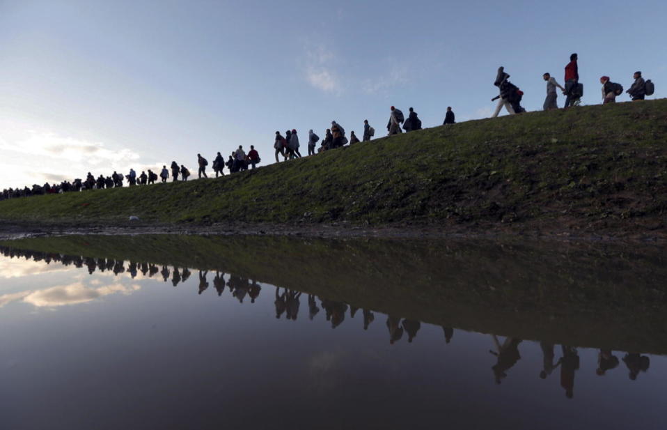 Migrants make their way on foot