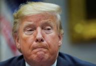 U.S. President Donald Trump listens during roundtable on small business at the White House in Washington