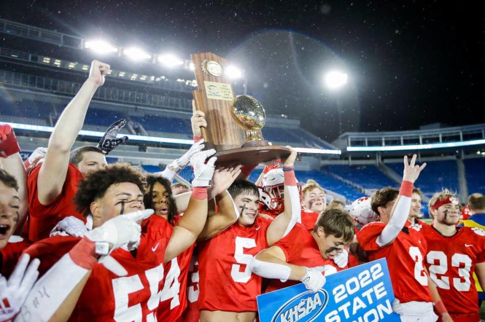 Beechwood receives its state championship trophy after holding on to defeat Mayfield 14-13 in Friday’s Class 2A title game at Kroger Field in Lexington.
