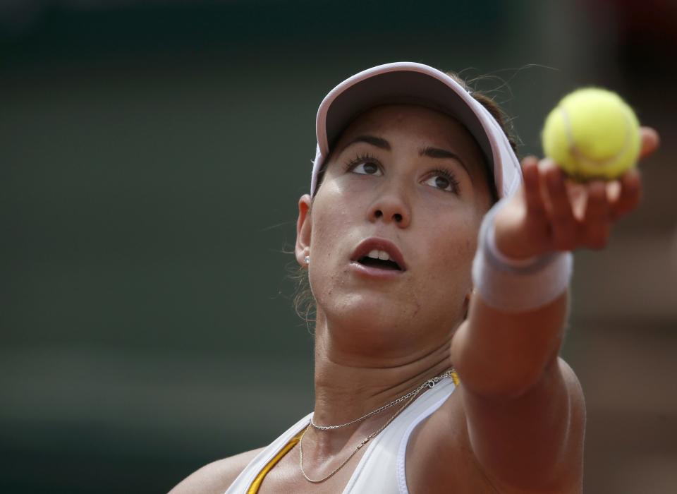 Garbine Muguruza of Spain serves to Lucie Safarova of the Czech Republic during their women's quarter-final match during the French Open tennis tournament at the Roland Garros stadium in Paris