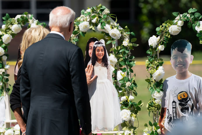 President Joe Biden and First Lady Dr. Jill Biden visit a memorial at Robb Elementary School. - Credit: AP Photo/Evan Vucci.