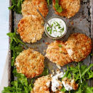 <p>These craveworthy fish cakes are made with a blend of crabmeat and pink salmon and coated with a panko-oat crust. Served on a bed of lemony arugula with a yogurt dip, this 45-minute entree is a great choice for a healthy family dinner.</p> <p> <a href="https://www.eatingwell.com/recipe/266493/salmon-crab-cakes/" rel="nofollow noopener" target="_blank" data-ylk="slk:View Recipe;elm:context_link;itc:0;sec:content-canvas" class="link ">View Recipe</a></p>