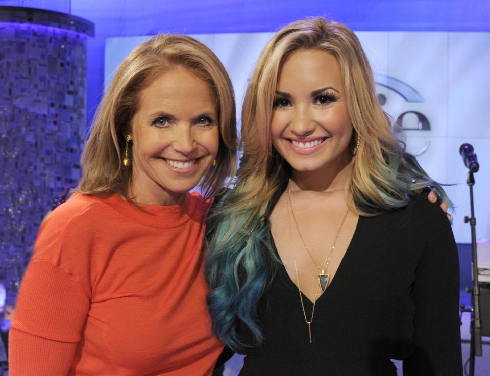 This undated photo released by ABC shows host Katie Couric, left, with actress-singer and judge on the singing competition series "The X Factor," Demi Lovato during the taping of an appearance on "Katie," in New York. The interview will air on Monday, Sept. 24. (AP Photo/Disney-ABC Domestic Television, Ida Mae Astute)