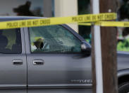 <p>A cars windows are shattered by bullets at the scene of a shooting along Wesleyan at Law Street in Houston that left multiple people injured and the alleged shooter dead, Sunday morning, Sept. 25, 2016. (Mark Mulligan/Houston Chronicle via AP) </p>