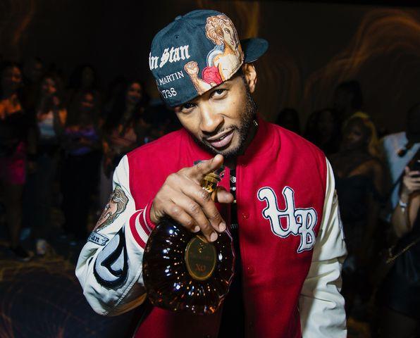 <p>Greg Doherty/Getty Images for Remy Martin</p> Usher poses for a photo in Las Vegas on July 15, 2023