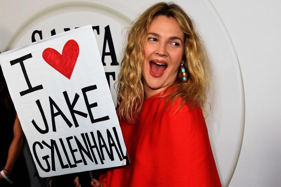 Apology: Drew Barrymore waved her sign after branding Jake Gyllenhaal her