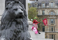 Actors dressed as pantomime dames protest at Trafalgar Square as they march on Parliament to demand more support for the theatre sector amid the COVID-19 pandemic in London, Wednesday, Sept. 30, 2020. (AP Photo/Frank Augstein)