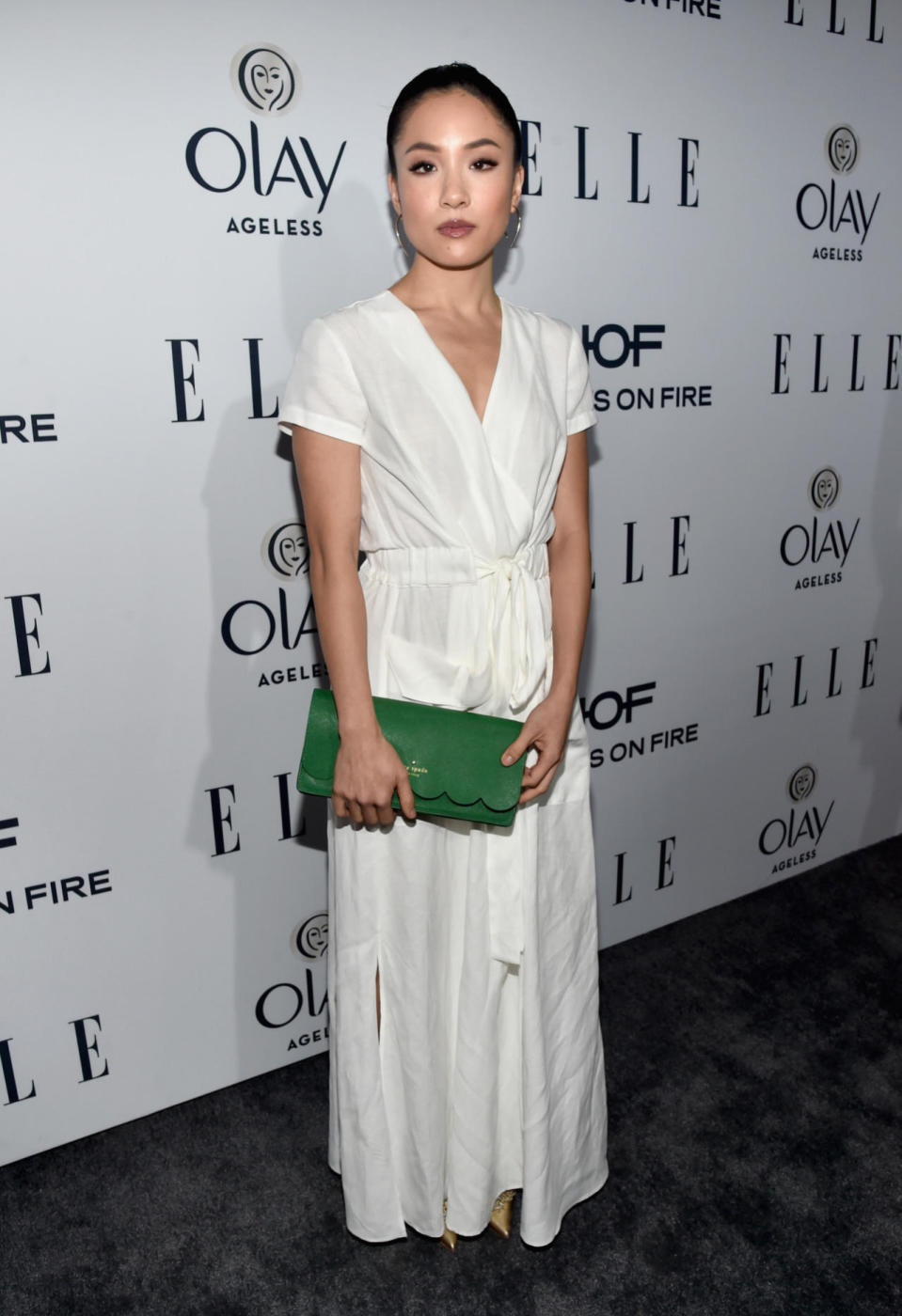 Constance Wu in Le Jaunce with a Kate Spade clutch at the ELLE Women in Television dinner.