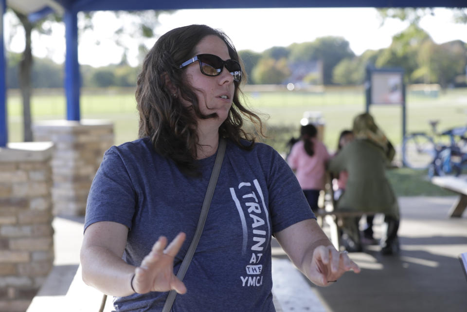 Megan Gettelfinger discusses the impeachment inquiry into President Donald Trump while in a park, Wednesday, Oct. 9, 2019, in Fishers, Ind. (AP Photo/Darron Cummings)