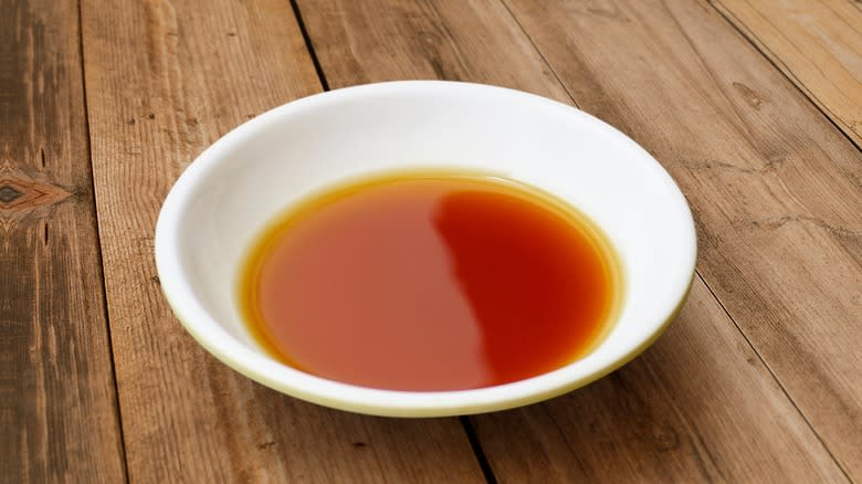 small dish of fish sauce on a wooden table