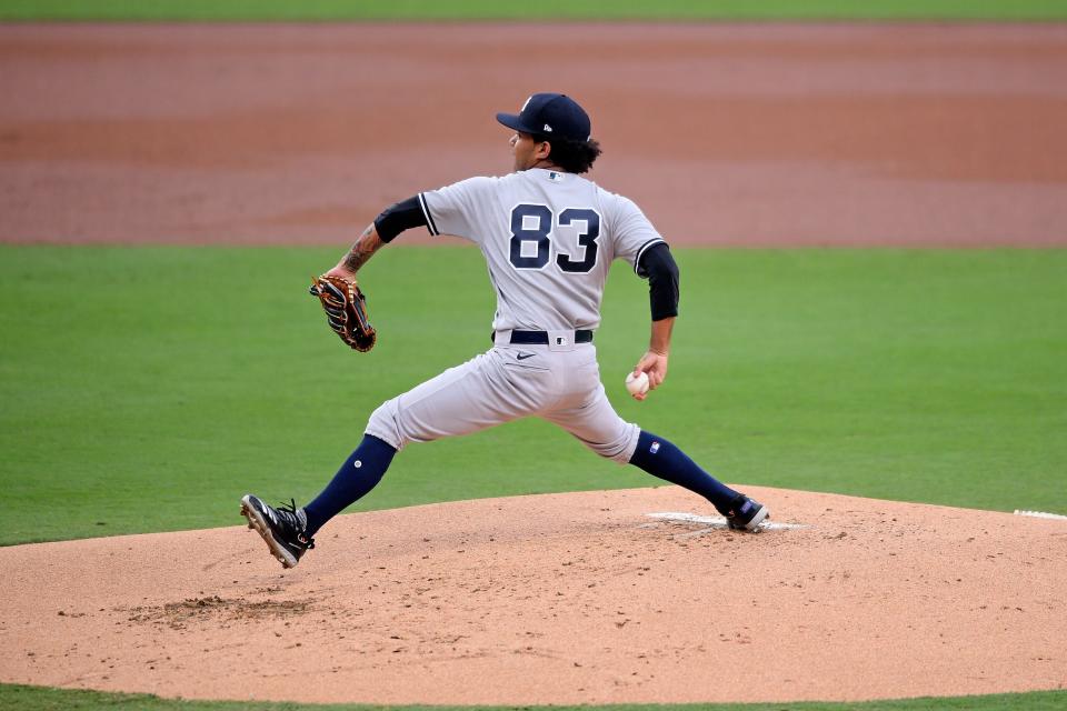 Oct 6, 2020; San Diego, California, USA; New York Yankees starting pitcher Deivi Garcia (83) delivers a pitch in the 1st inning against the Tampa Bay Rays during game two of the 2020 ALDS at Petco Park. Mandatory Credit: Orlando Ramirez-USA TODAY Sports