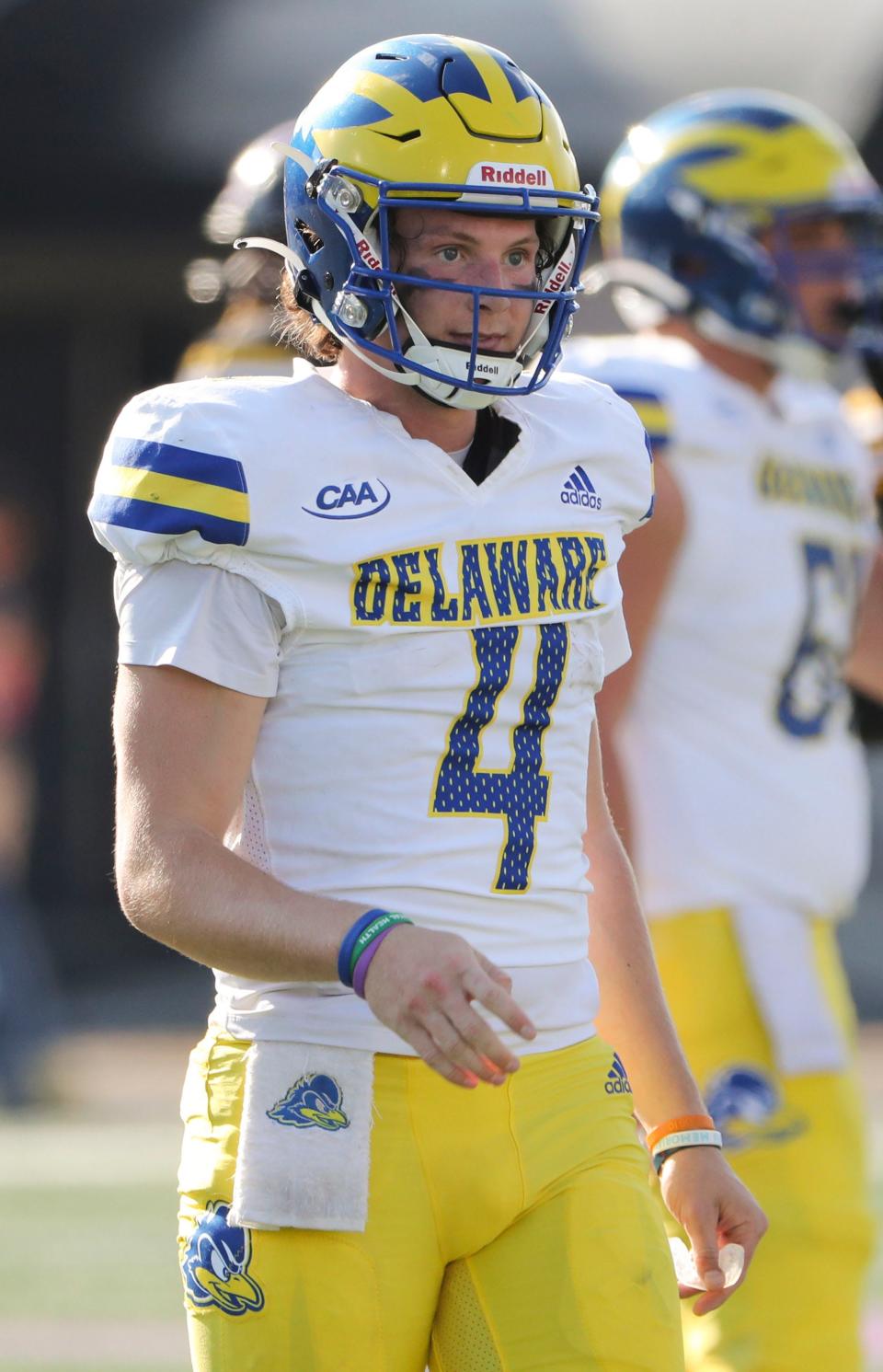 Delaware quarterback Nick Minicucci looks to the sidelines for the play call as he works in the fourth quarter of the Blue Hens' 51-13 win against Towson at Johnny Unitas Stadium in Towson, Md., Saturday, Oct. 28, 2023.
