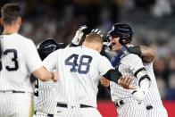 New York Yankees' Josh Donaldson celebrates with teammates after hitting a walk-off RBI single during the tenth inning of a baseball game against the Boston Red Sox Thursday, Sept. 22, 2022, in New York. The Yankees won 5-4. (AP Photo/Frank Franklin II)