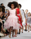 The Oscar de la Renta Spring 2013 childrenswear collection is modeled during Fashion Week, Wednesday, Sept. 12, 2012, in New York. (AP Photo/Jason DeCrow)