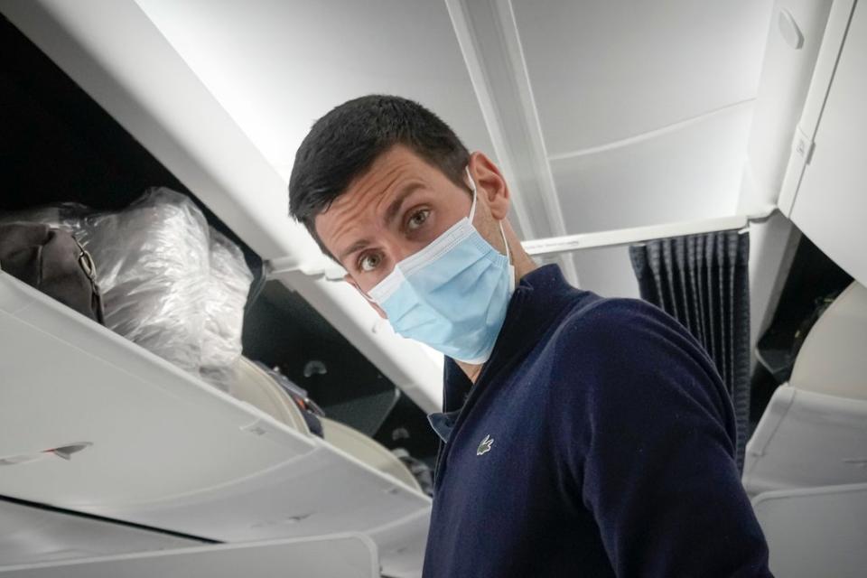 Novak Djokovic pictured on a plane bound for Serbia on Monday (Darko Bandic/AP) (AP)