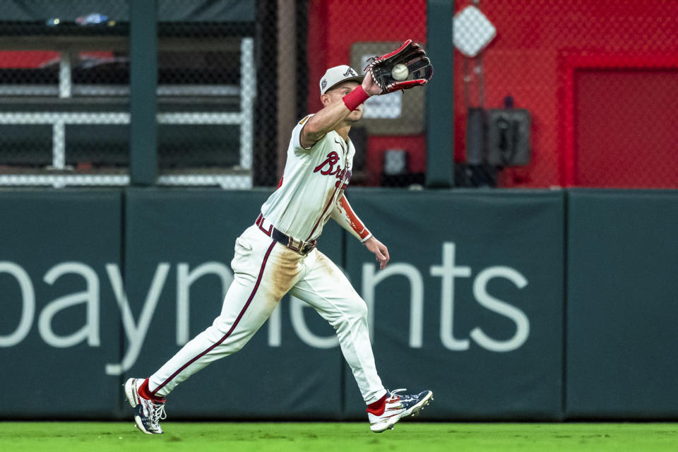 Atlanta Braves outfielder Jarred Kelenic catches a pop fly during the ninth inning of a baseball game against the San Fransisco Giants, Thursday, July 4, 2024, in Atlanta. (AP Photo/Jason Allen)