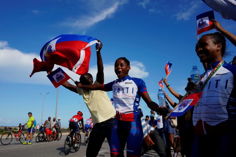 The Wider Image: Haiti's cyclists brave protests and poor roads in race for gold