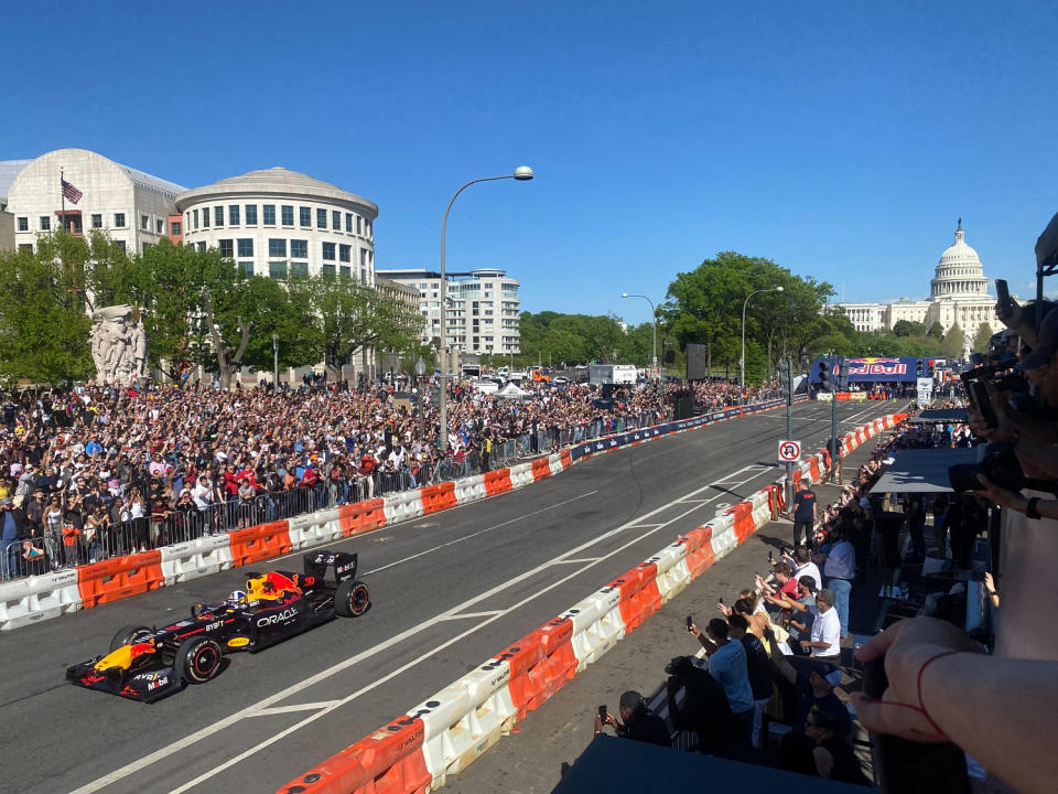 David Coulthard drives a Red Bull RB7 Formula 1 car down Pennsylvania Avenue in Washington, D.C., on Saturday. (Sahil Kapur / NBC News)