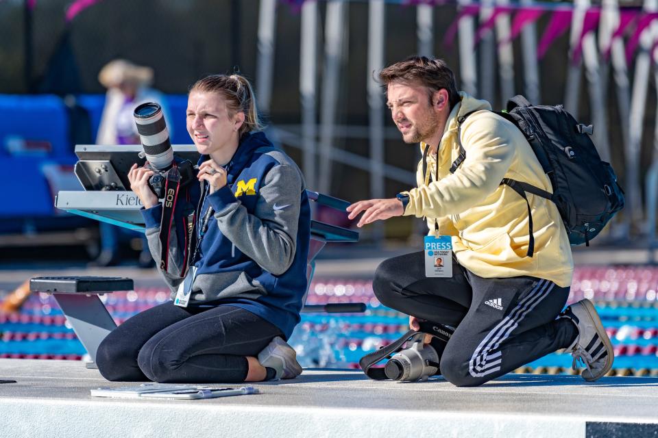Tallahassee Democrat photojournalist Alicia Devine. (left) and sports reporter Jack Williams (right) cover a local swim meet on Oct. 19, 2022.