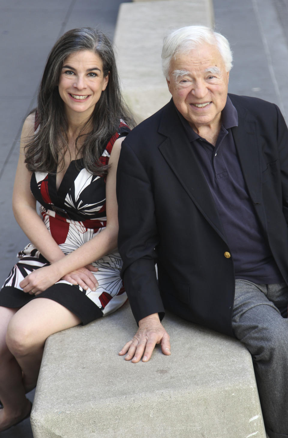 This May 20, 2012 image shows Arthur Frommer, 83, and his daughter, Pauline Frommer, 46, = in New York. The father-daughter team host a live weekly call-in radio show together called “The Travel Show,” on WOR-AM, which is carried on 115 radio stations across the U.S. (AP Photo/Seth Wenig)