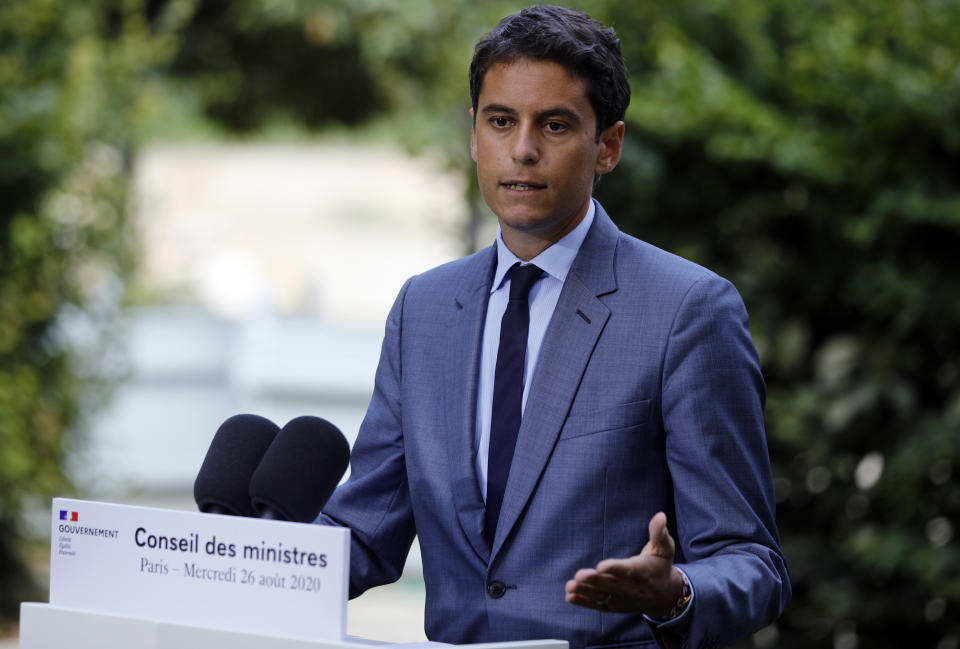 FILE - In this Wednesday, Aug.26, 2020 file photo, French government's spokesman Gabriel Attal speaks after the weekly cabinet meeting, at the Elysee Palace in Paris. France announced Wednesday, Oct.27, 2021 that it will bar British fishing boats from some French ports starting next week if no deal is reached with the U.K. in a dispute over fishing licenses – and suggested it may restrict energy supplies to the Channel Islands, too. After weeks of negotiations, British authorities have issued more licenses but that still only accounts for 50% of what France “is entitled to,” French government spokesman Gabriel Attal said Wednesday. (AP Photo/Kamil Zihnioglu, file)